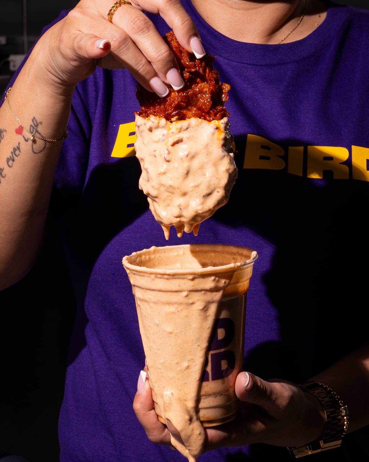 A BADBIRD chicken tender dipped in creamy sauce